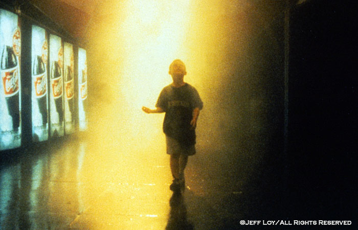 A boy walks through a raintent in Centennial Olympic Park in downtown Atlanta, Georgia.